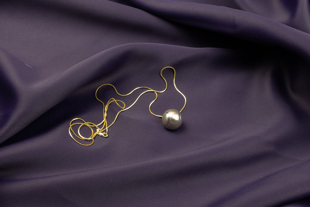 ‘Soothing Magic Ringing Ball’ Necklace